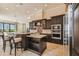 Elegant kitchen with dark wood cabinets, granite counters, and stainless steel appliances at 12310 Stonelake Ranch Blvd, Thonotosassa, FL 33592