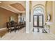 Formal dining room with large table and chairs, adjacent to the entryway at 12310 Stonelake Ranch Blvd, Thonotosassa, FL 33592
