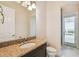 Clean bathroom with granite countertop and access to backyard at 12310 Stonelake Ranch Blvd, Thonotosassa, FL 33592