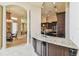 Kitchen features a breakfast bar with granite countertops and dark wood cabinets at 12310 Stonelake Ranch Blvd, Thonotosassa, FL 33592
