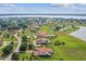 Luxury waterfront home with expansive green lawn at 12310 Stonelake Ranch Blvd, Thonotosassa, FL 33592