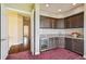 Wet bar with dark cabinetry and granite countertop at 12310 Stonelake Ranch Blvd, Thonotosassa, FL 33592