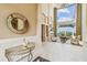 Bright entryway with a large mirror and decorative console table at 12310 Stonelake Ranch Blvd, Thonotosassa, FL 33592