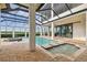 Relaxing pool and spa area with covered lanai, offering a resort-like atmosphere at 12310 Stonelake Ranch Blvd, Thonotosassa, FL 33592