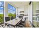 Covered patio with outdoor kitchen, grill, and seating area at 12310 Stonelake Ranch Blvd, Thonotosassa, FL 33592