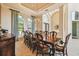 Formal dining room with large wood table and seating for ten at 12310 Stonelake Ranch Blvd, Thonotosassa, FL 33592