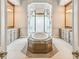 Spa-like bathroom with a large soaking tub, double vanities, and a walk-in shower at 12310 Stonelake Ranch Blvd, Thonotosassa, FL 33592