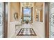 Elegant two-story entry with chandelier and views to the living room and backyard at 12310 Stonelake Ranch Blvd, Thonotosassa, FL 33592