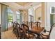Bright dining room featuring a large wood table and ample natural light at 12310 Stonelake Ranch Blvd, Thonotosassa, FL 33592