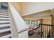 Elegant staircase offering a view of the living room and backyard at 12310 Stonelake Ranch Blvd, Thonotosassa, FL 33592