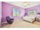 Lavender bedroom with a comfortable bed and plenty of natural light at 12310 Stonelake Ranch Blvd, Thonotosassa, FL 33592