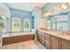 Bathroom with a double vanity, soaking tub, and a large shower at 12310 Stonelake Ranch Blvd, Thonotosassa, FL 33592