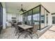 Outdoor kitchen and dining area with built-in grill and seating at 12310 Stonelake Ranch Blvd, Thonotosassa, FL 33592