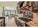 Modern kitchen with stainless steel appliances and views into Gathering room at 12310 Stonelake Ranch Blvd, Thonotosassa, FL 33592