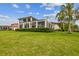 Spacious backyard with lush lawn and stunning home view at 12310 Stonelake Ranch Blvd, Thonotosassa, FL 33592