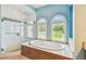 Bathroom with a soaking tub, walk-in shower, and natural light at 12310 Stonelake Ranch Blvd, Thonotosassa, FL 33592