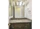 Bathroom with granite countertop sink and dark brown cabinets at 12310 Stonelake Ranch Blvd, Thonotosassa, FL 33592