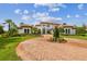 Luxury home with brick driveway and Mediterranean style architecture at 12310 Stonelake Ranch Blvd, Thonotosassa, FL 33592