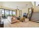 Spacious living room with large sectional sofa and access to outdoor patio at 12310 Stonelake Ranch Blvd, Thonotosassa, FL 33592