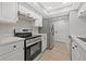 Modern kitchen with stainless steel appliances and white cabinets at 12411 Titus Ct # 12411, Tampa, FL 33612