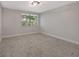 Bright and airy bedroom with neutral walls and carpet at 12411 Titus Ct # 12411, Tampa, FL 33612
