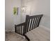 Modern staircase with black railings leading to upper level at 12411 Titus Ct # 12411, Tampa, FL 33612