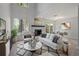 Living room with fireplace, light walls, and wood-look floors at 12411 Titus Ct # 12411, Tampa, FL 33612