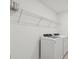 Laundry room with washer, dryer, and overhead shelving at 10624 Hidden Banks Gln, Parrish, FL 34219