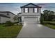 Two-story house with attached garage and landscaping at 10624 Hidden Banks Gln, Parrish, FL 34219