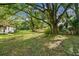 Residential lot with mature trees and a home visible at 7207 Westinghouse Ave, Tampa, FL 33619