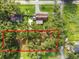 Large vacant lot with mature trees and potential for new development at 7207 Westinghouse Ave, Tampa, FL 33619
