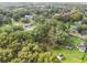 Aerial view showing the property's position among residential homes and trees at 7207 Westinghouse Ave, Tampa, FL 33619