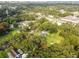 Aerial view showing the lot's surroundings with houses and trees at 7207 Westinghouse Ave, Tampa, FL 33619