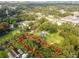 Rectangular vacant lot surrounded by trees and houses at 7207 Westinghouse Ave, Tampa, FL 33619