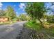 Residential street view with a home and parked vehicles at 7207 Westinghouse Ave, Tampa, FL 33619