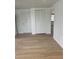 Hallway with light colored floors and doors at 12739 3Rd Isle, Hudson, FL 34667