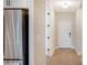 Bright entryway with wood floors and view into the kitchen at 12706 Palatka Dr, Venice, FL 34293