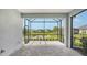 Screened patio with paver stones and scenic pond view at 12706 Palatka Dr, Venice, FL 34293