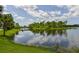 Scenic lake view with a wooden footbridge at 12706 Palatka Dr, Venice, FL 34293