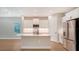 Modern kitchen with white cabinets, quartz countertops, and stainless steel appliances at 12706 Palatka Dr, Venice, FL 34293