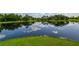 Scenic lake surrounded by lush greenery and trees at 12706 Palatka Dr, Venice, FL 34293