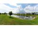 Serene community lake with homes reflecting in the water at 12706 Palatka Dr, Venice, FL 34293