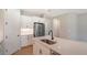 Modern kitchen with white cabinets, quartz countertops and a large island at 12706 Palatka Dr, Venice, FL 34293