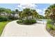 Landscaped walkway leading to the community pool and clubhouse at 12706 Palatka Dr, Venice, FL 34293