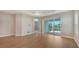 Bright bedroom with wood floors and sliding glass doors leading to a patio at 12706 Palatka Dr, Venice, FL 34293