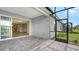Covered patio with pavers, access from sliding doors and screened enclosure at 12706 Palatka Dr, Venice, FL 34293