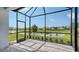 Enjoy the view from this screened patio overlooking a pond at 12706 Palatka Dr, Venice, FL 34293