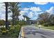 Curved driveway leads to Grand Palm’s gated entrance at 12706 Palatka Dr, Venice, FL 34293