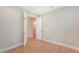 Spacious bedroom with wood floors and access to hallway at 12706 Palatka Dr, Venice, FL 34293