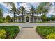 Community clubhouse with welcoming porch and landscaping at 12706 Palatka Dr, Venice, FL 34293